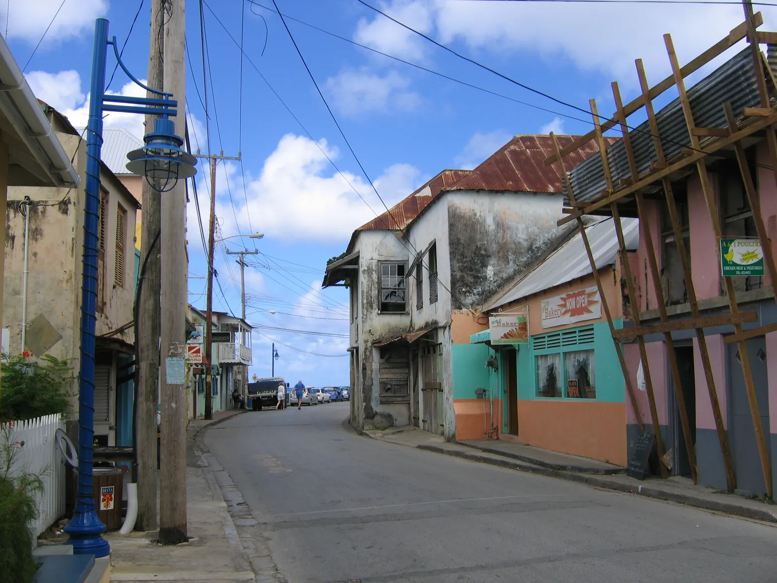 Older masonry and timber shopfronts lining a street in Speightstown, St Peter, Barbados
