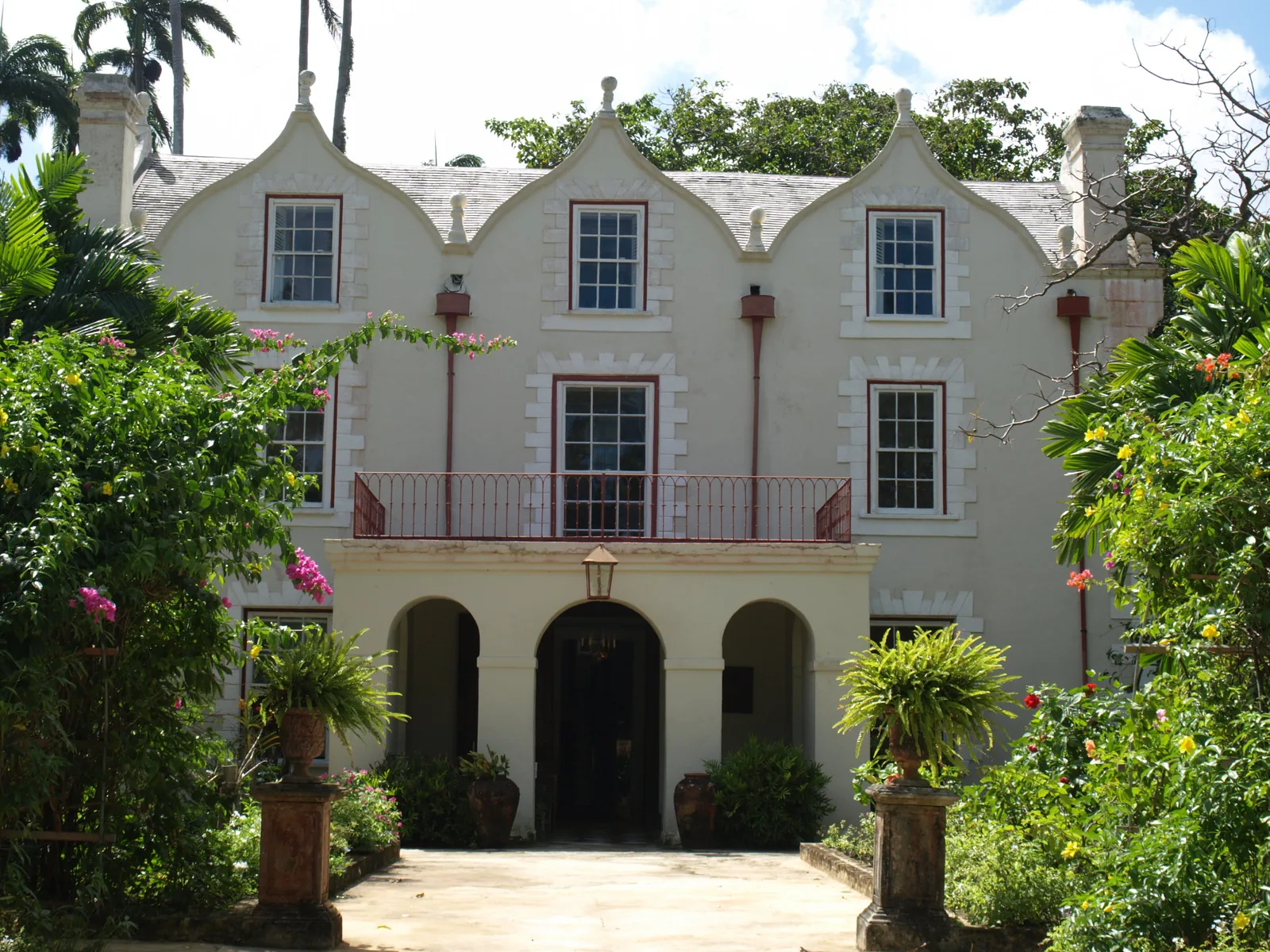 St Nicholas Abbey in St Peter, Barbados: a 1658 coral-stone Jacobean great house with curvilinear gables and a shaded arcaded entrance