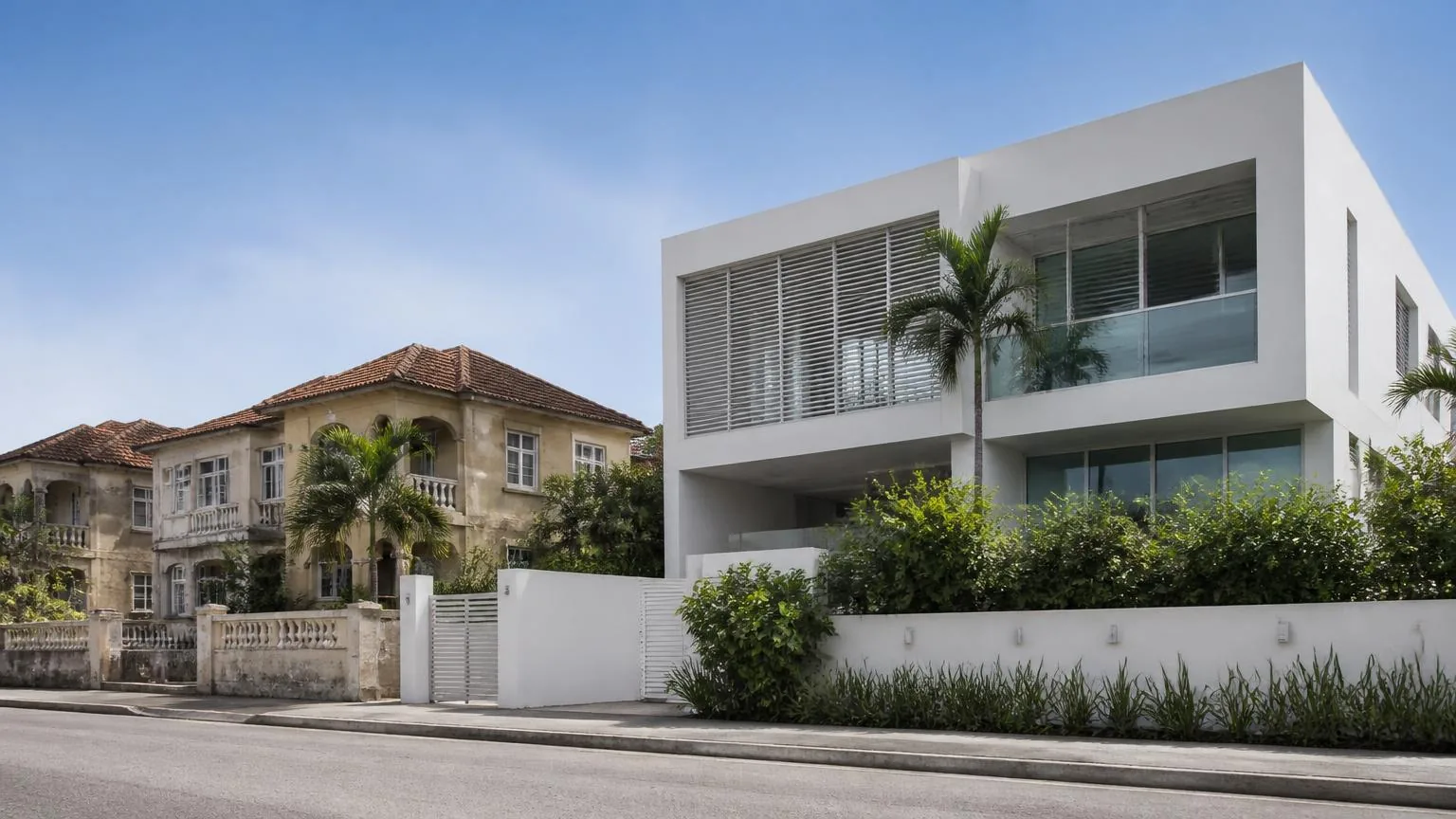 A 1990s Barbadian villa standing beside a contemporary minimal house